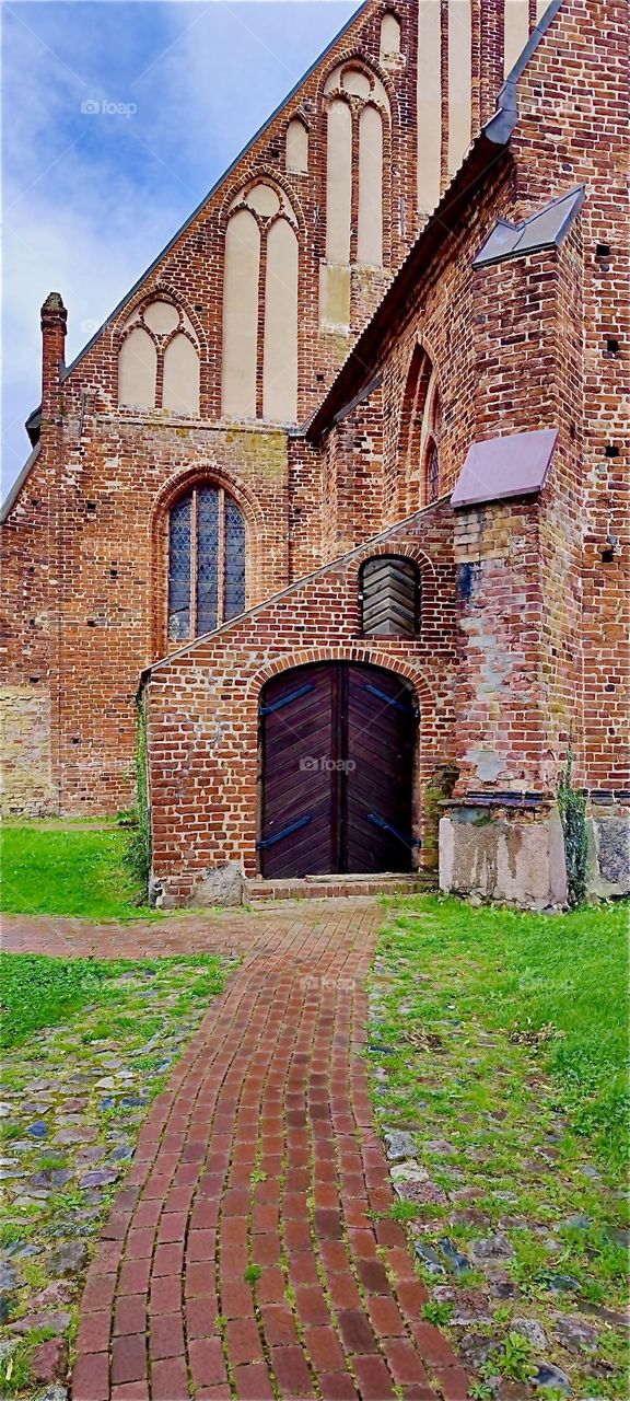 This is the “St. George” church in the municipality of “Wiek” in “Mecklenburg - Western Pomerania”, Germany by the “Baltic Sea”. Construction of the brownstone church began around 1400. 2024. Hypnotic Productions
