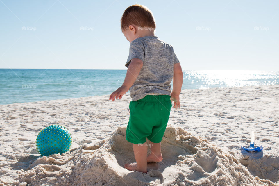 Standing tall on his sand tower