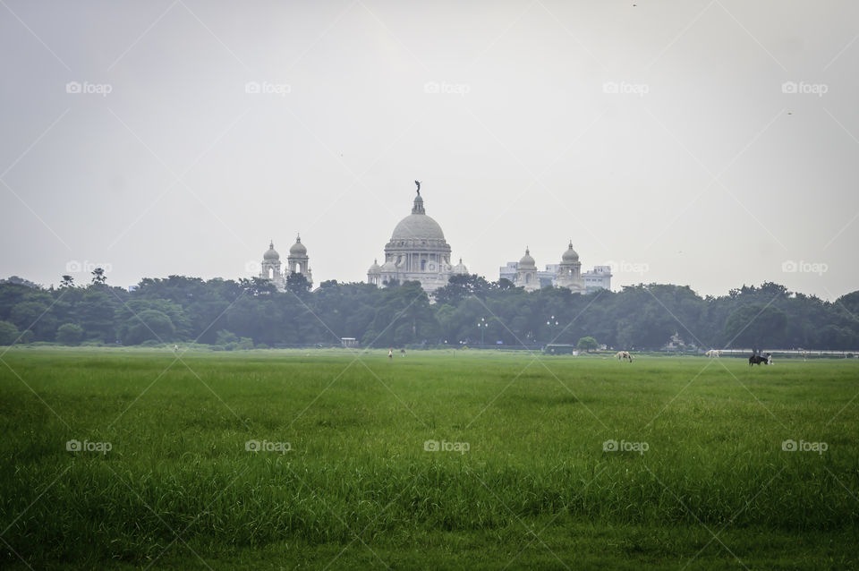 Beautiful image of Victoria Memorial snap from distance, from Moidan, Kolkata , Calcutta, West Bengal, India. A Historical Monument, large marble building dedicated to memory of Queen Victoria.