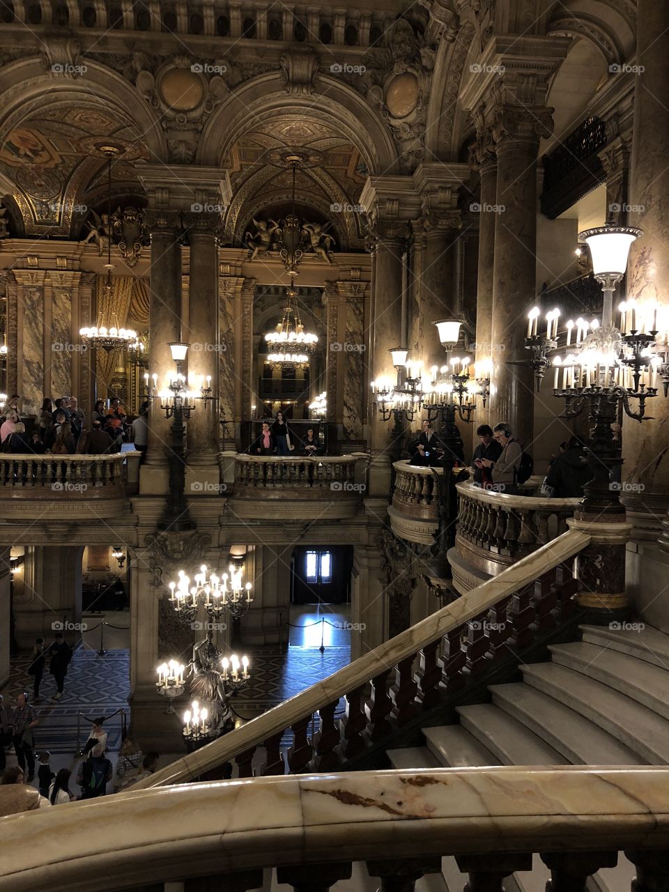 Another view of the grand staircase inside the Garnier Opera House in Paris, France.