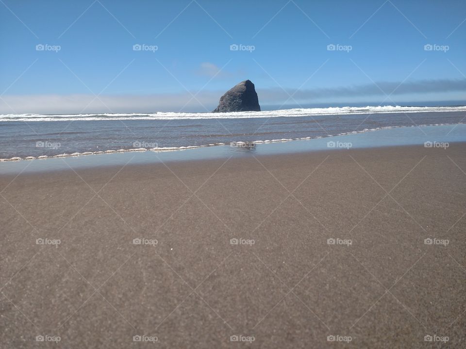 Giant rock of Pacific City beach.