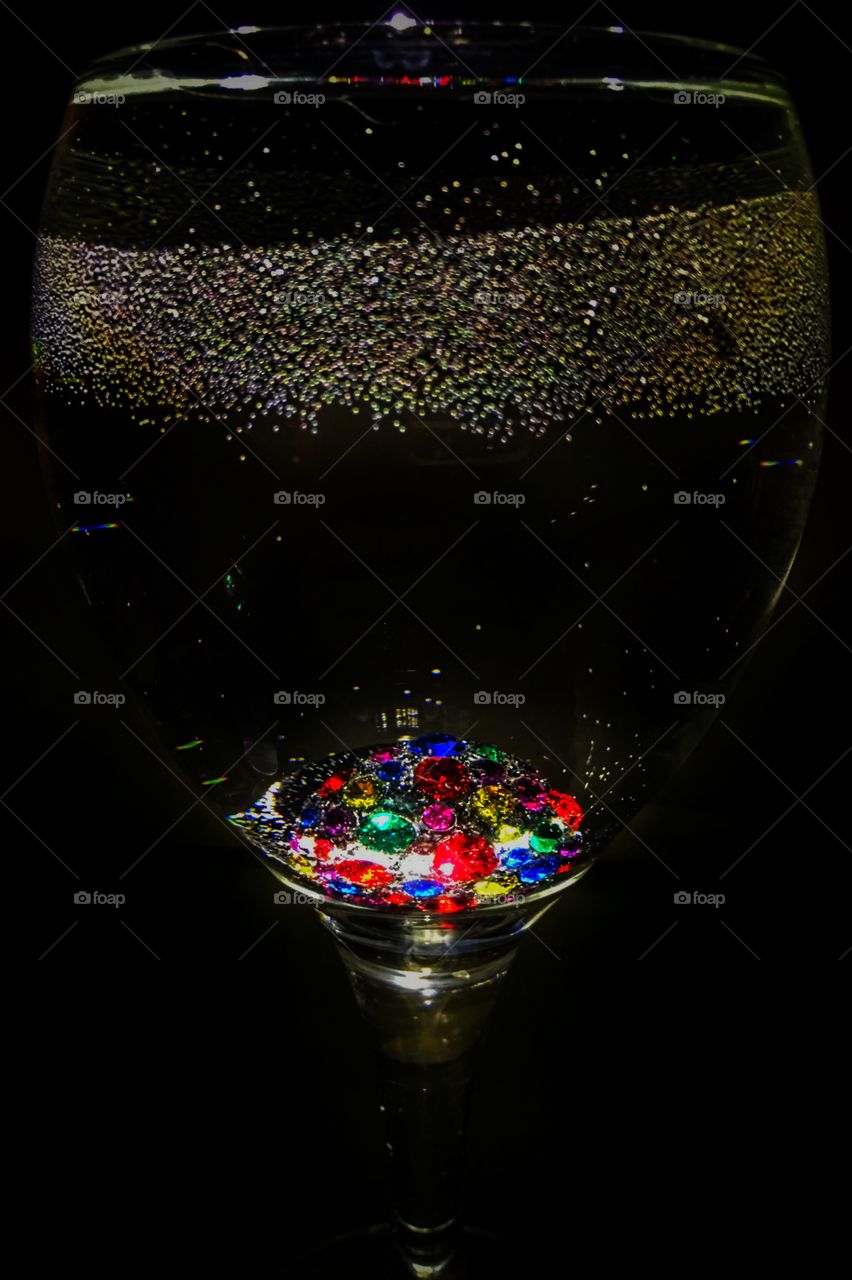 Color rhinestone ring in a wine glass