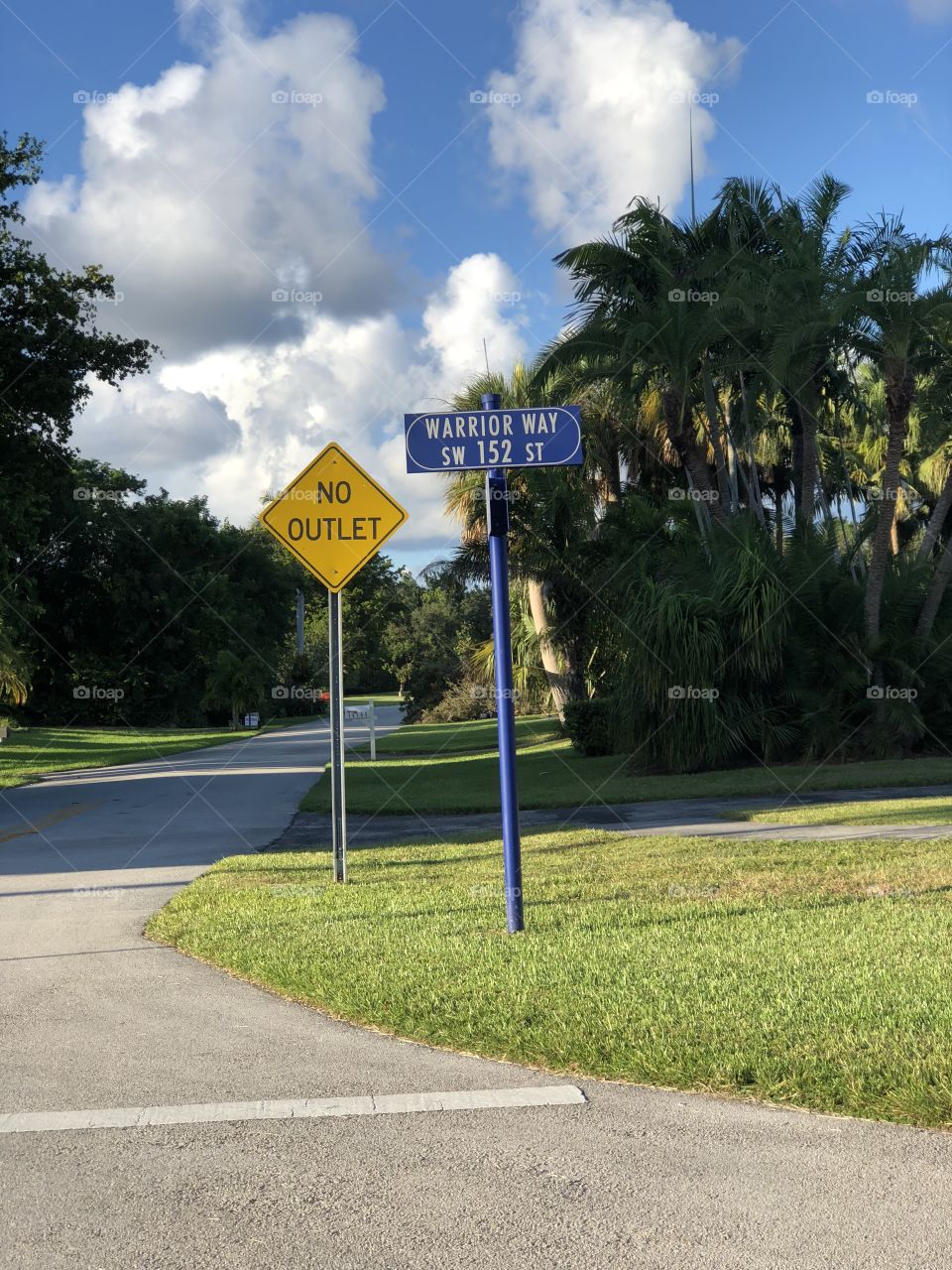 Warrior Way street sign and No Outlet street sign