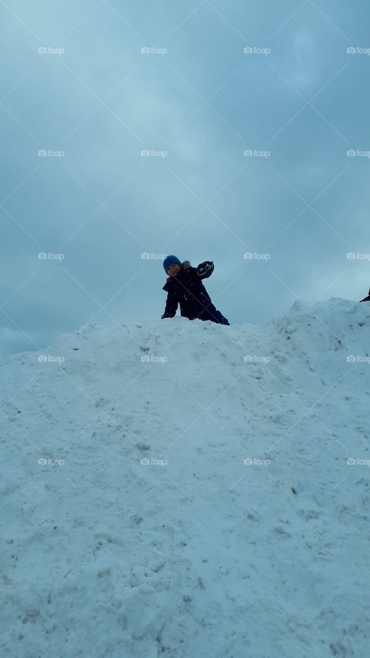 Child on a snow hill