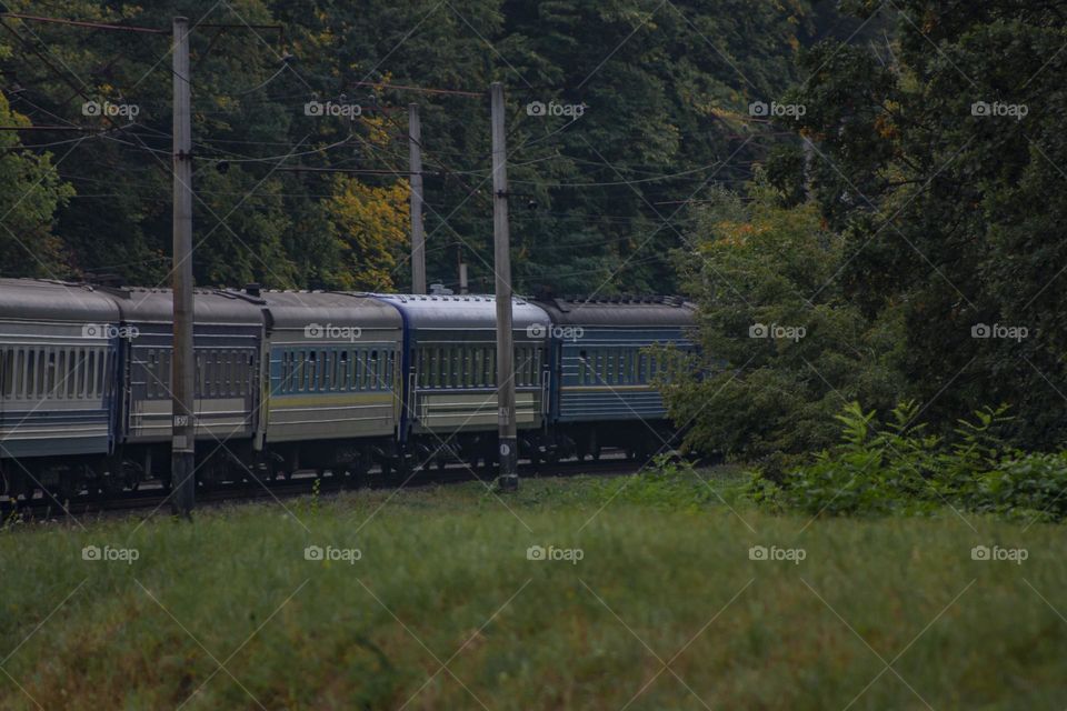 A passenger train rushes into the distance🔥