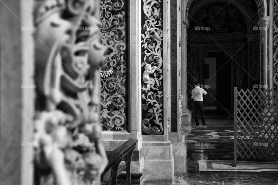 A violinist is playing music on a church