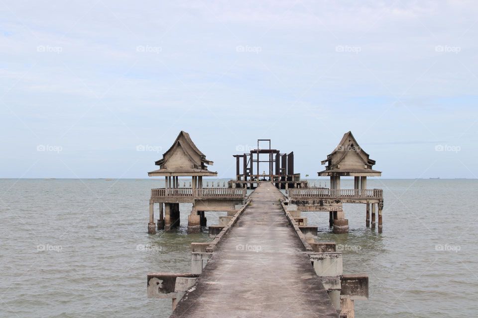 the pier at an abandoned Buddhist Thai Temple by the Gulf of Thailand Southeast Asia