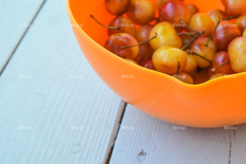 Fruits on orange bowl