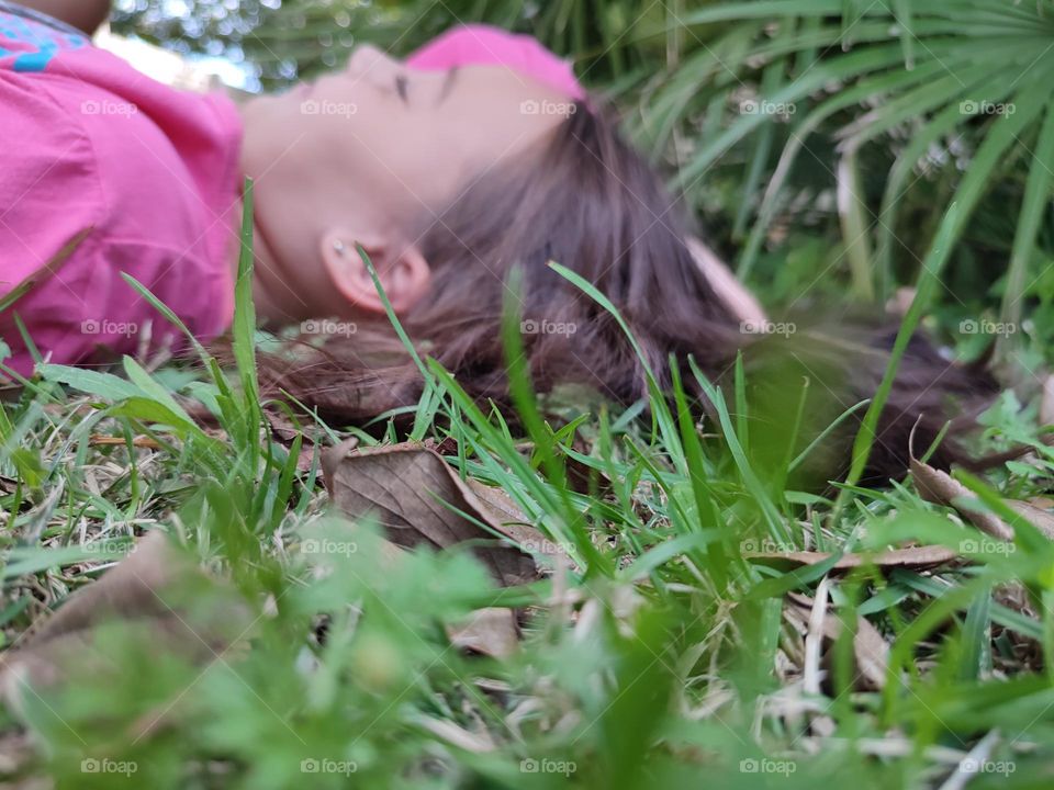 Laying, on grass