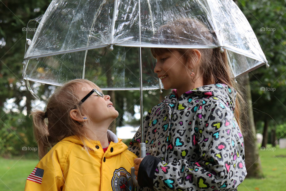 two sisters under the umbrella