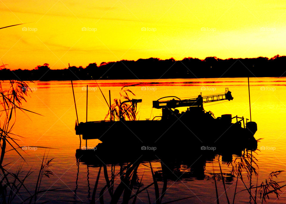 Barge at Sunset. This construction barge was at a still life position after a day's work rebuilding docks!