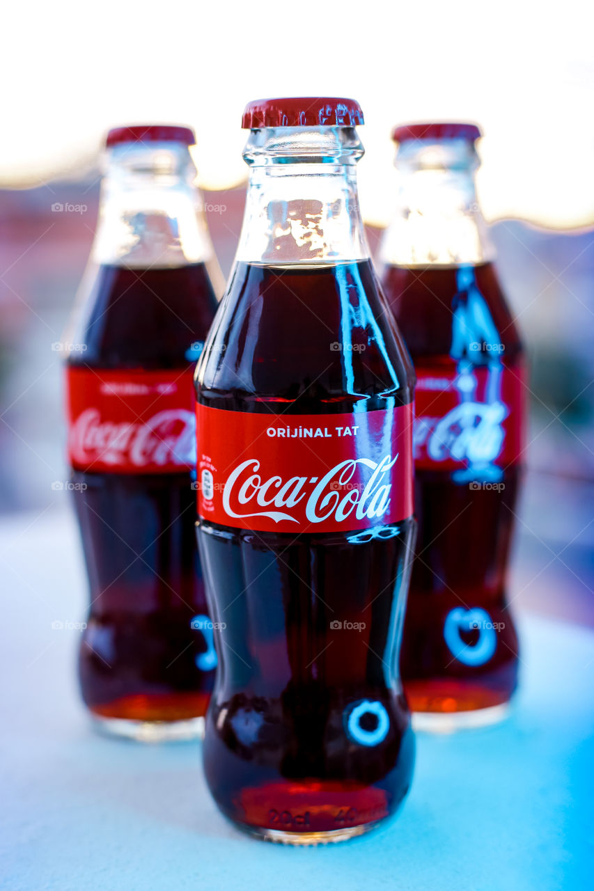 Three bottles of Coca Cola
