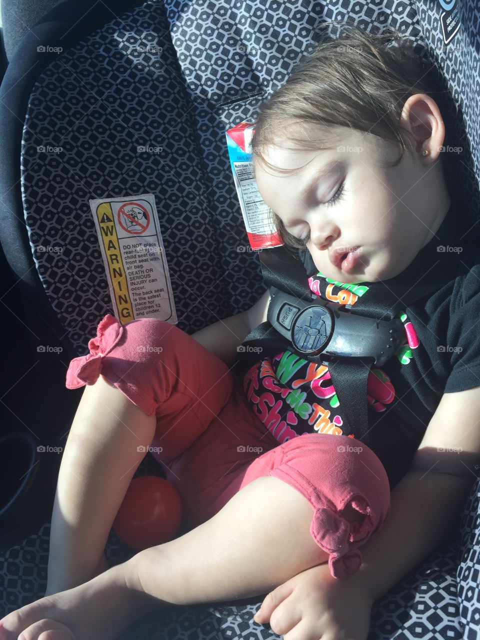 Baby sleeping in car seat