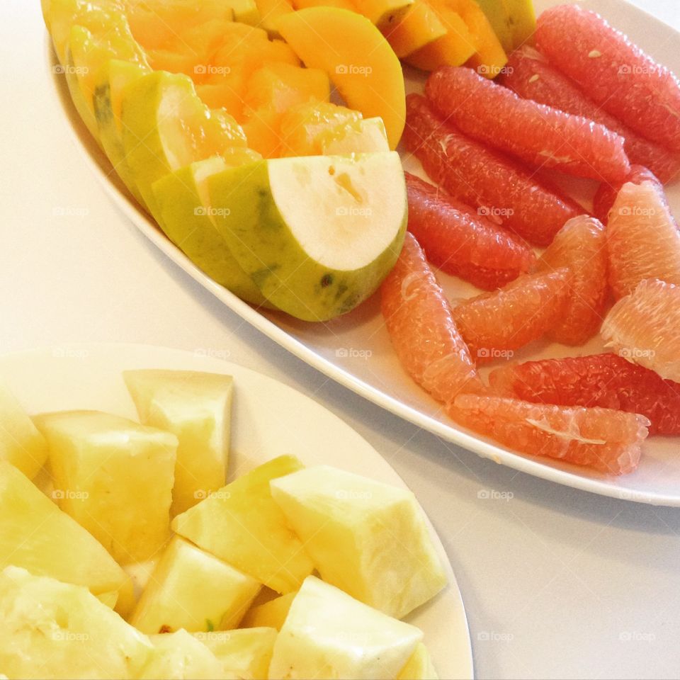 Healthy snacking with a tropical fruits platter during summer.