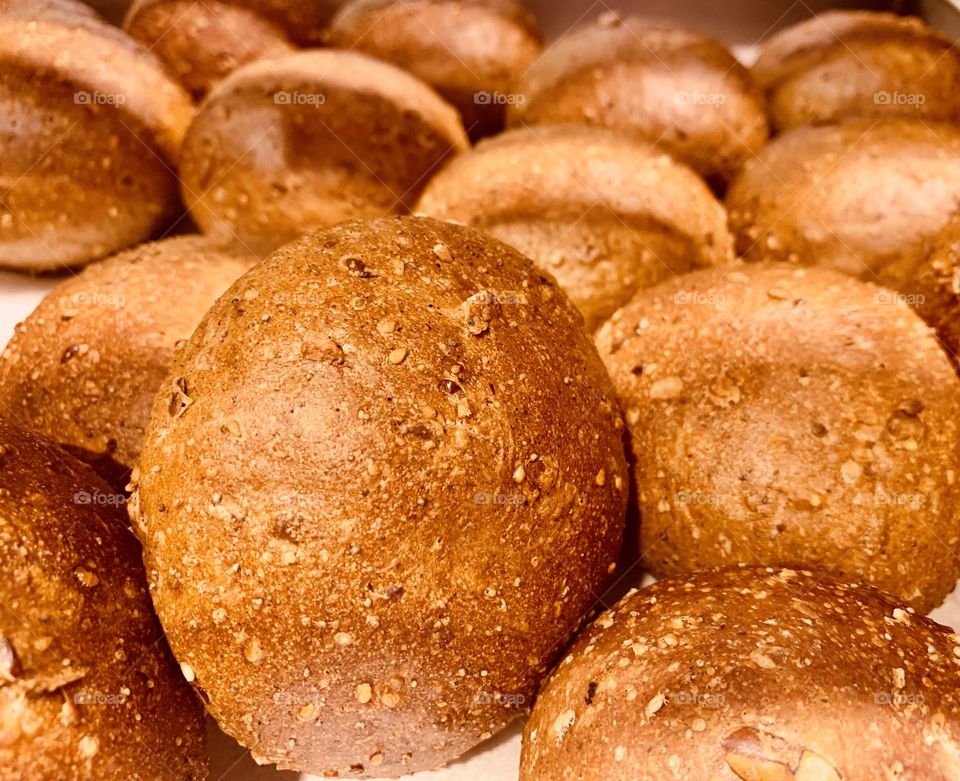 Freshly baked hand made rustic brown bread buns 