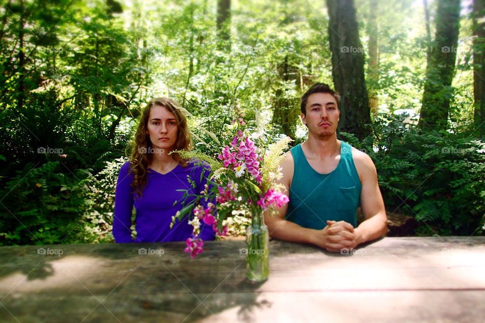 Stoic couple in the woods