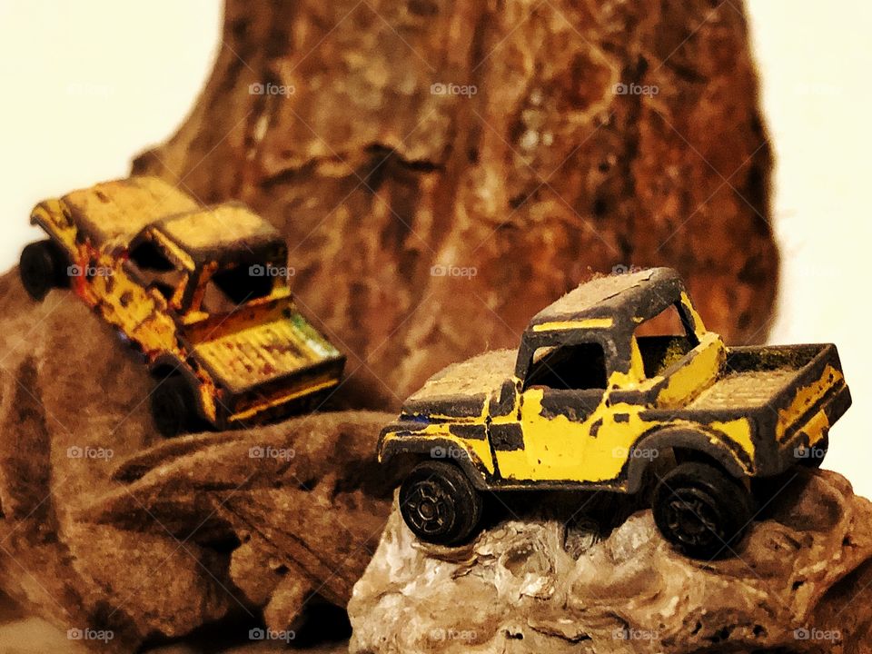 Toy trucks on rock terrain 
