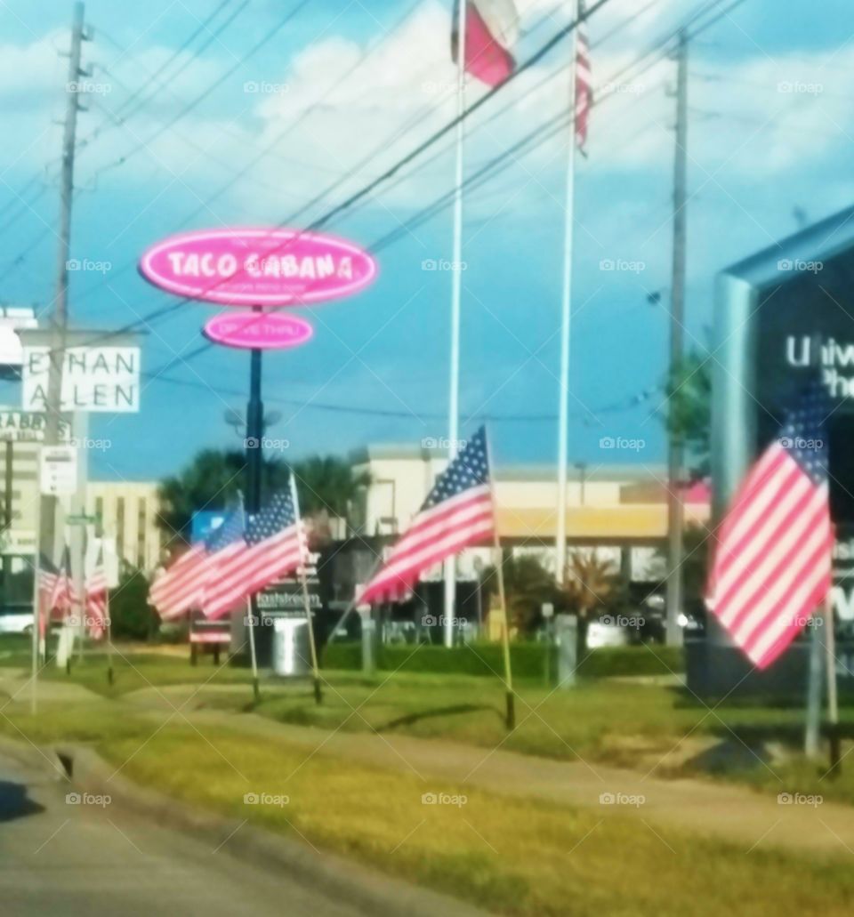 Memorial Day Flags along the Freeway lines I-10 from University of Phoenix then captures Taco Cabana and Ethan Allen in the background!