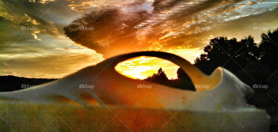 Golden hour through a shell. Lakeside sunrise looking through a shell during the golden hour