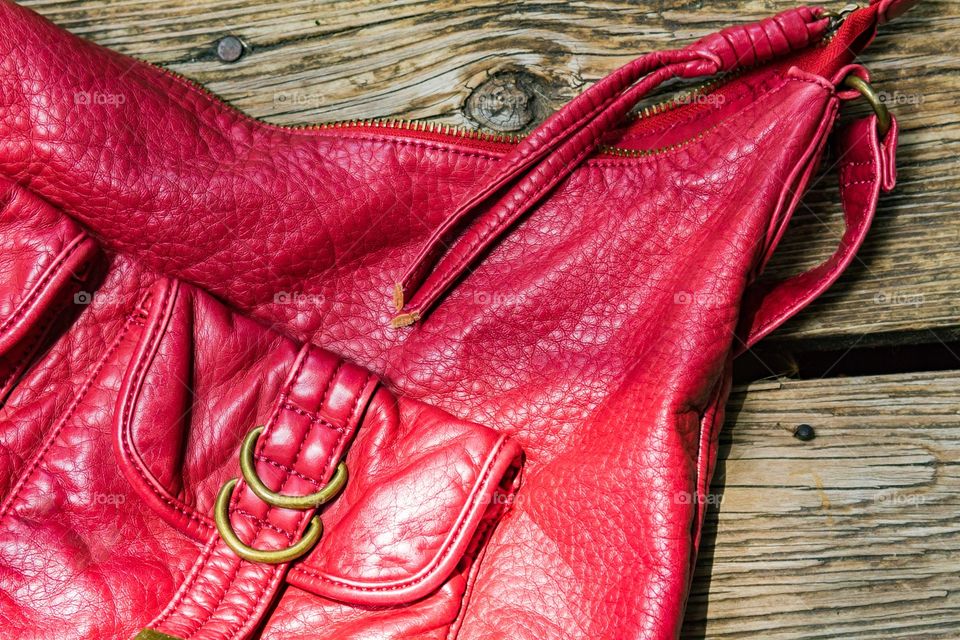 Red textured purse with wood