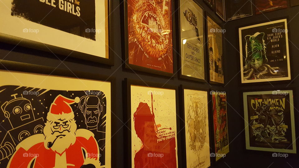 A wall covered in classic horror movie posters.