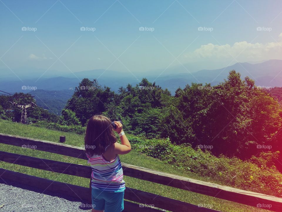 Little explorer. My daughter checking out the other side of the mountain