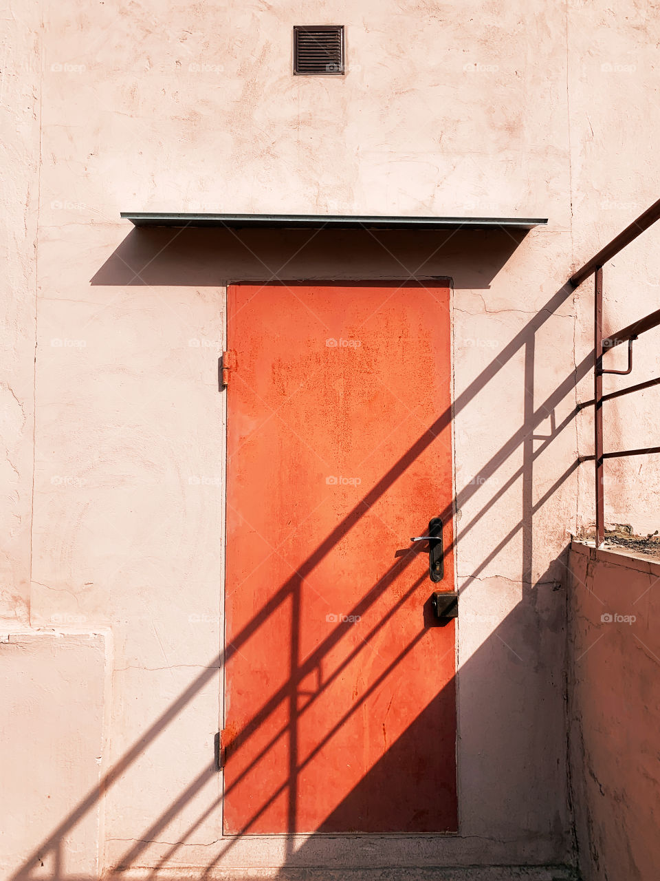 Shadows on orange door 