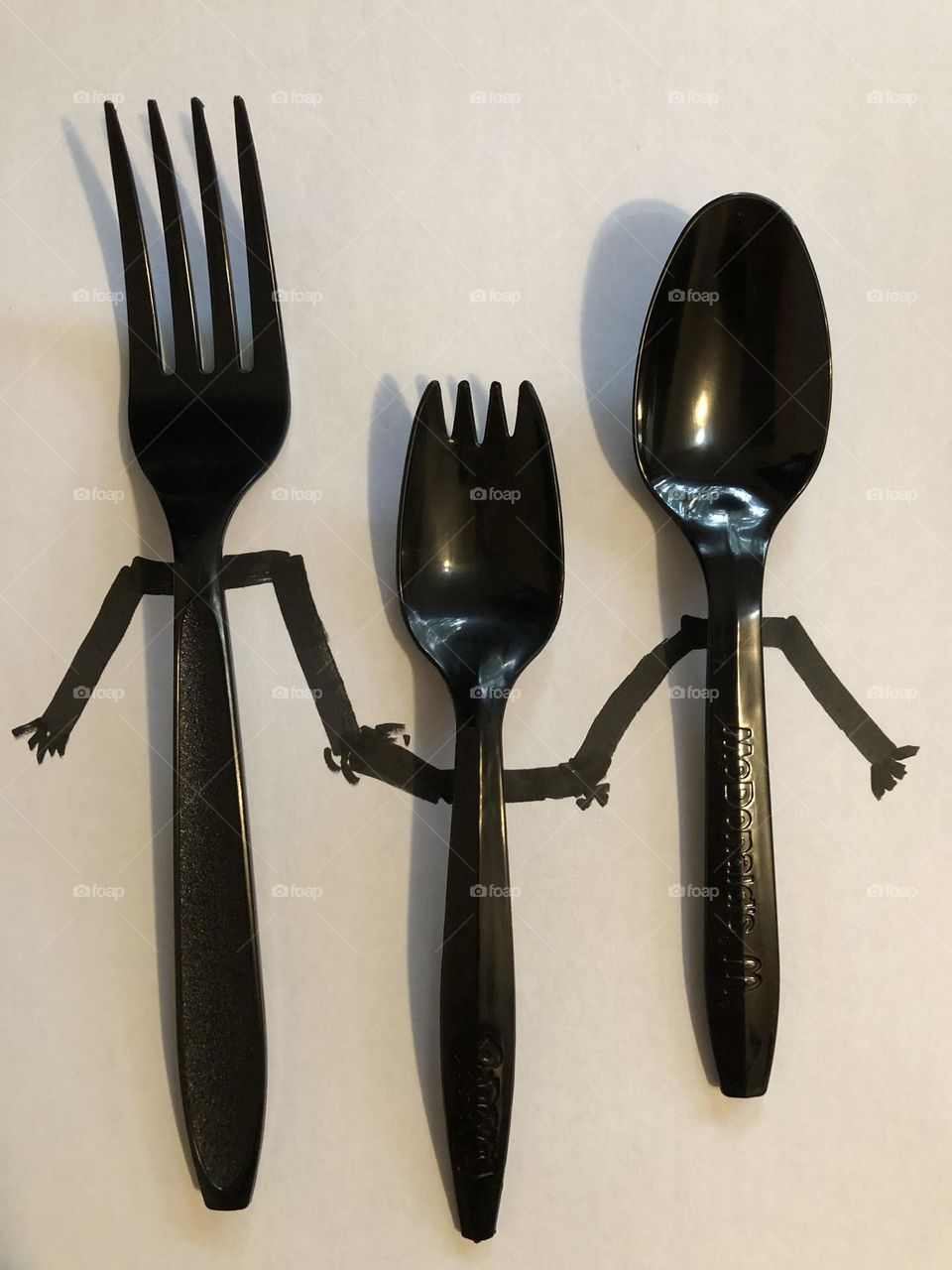 Fork family father fork mother spoon baby spork holding hands black and white