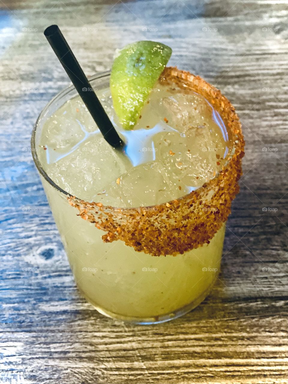 Margarita with mescal and lime wedge with a trim of spices