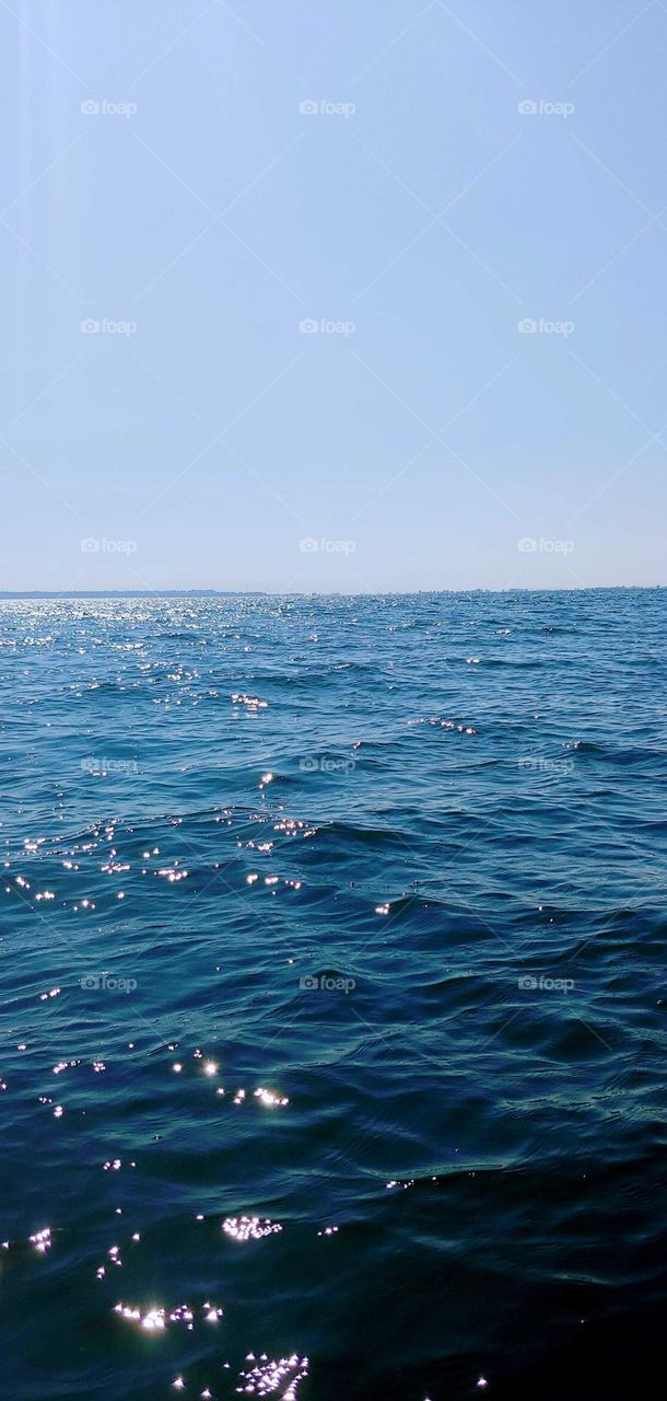 water glistening from the sun in small waves .sparkling water