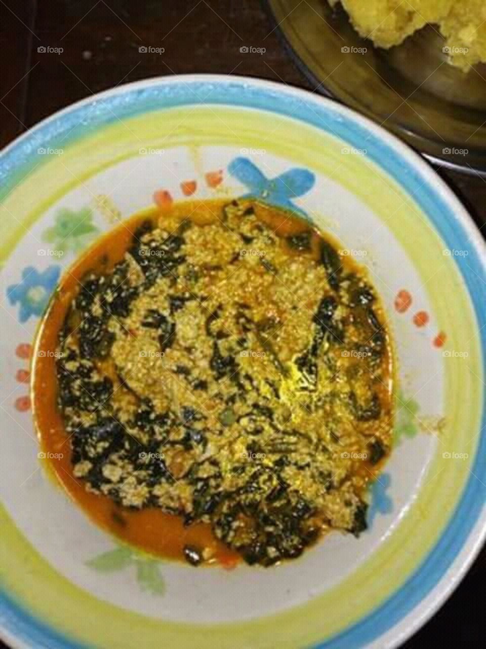 This is one of the many rich delicacies of the South-Eastern Nigeria, Popularly known as the Indigenous people of Biafra and they call this one "Egusi-Soup" ... It is usually taken with Fufu,garri,semovita,wheat or corn mill ... visitors take notes