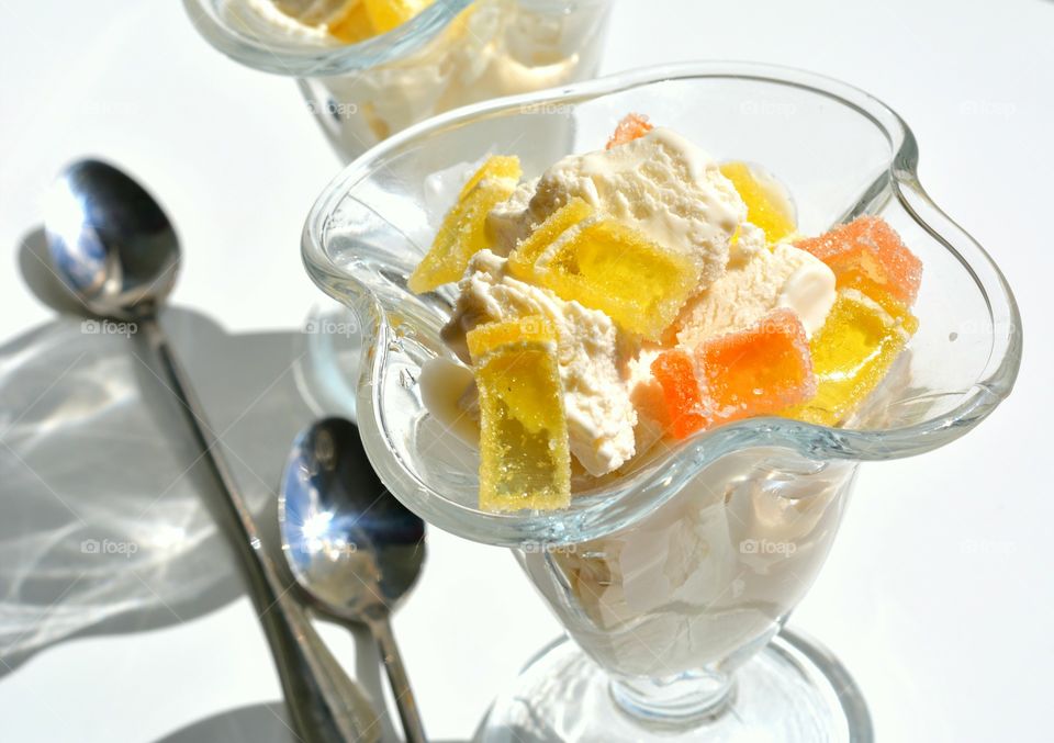 tasty Ice cream with sweets table white background