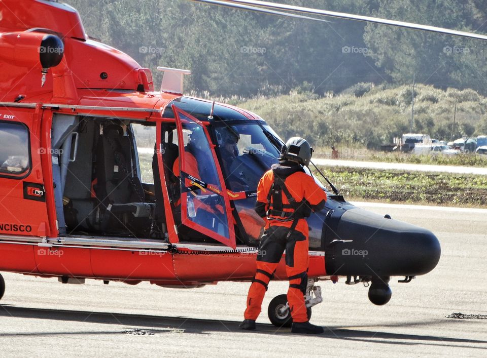 Coast Guard Helicopter And Flight Crew
