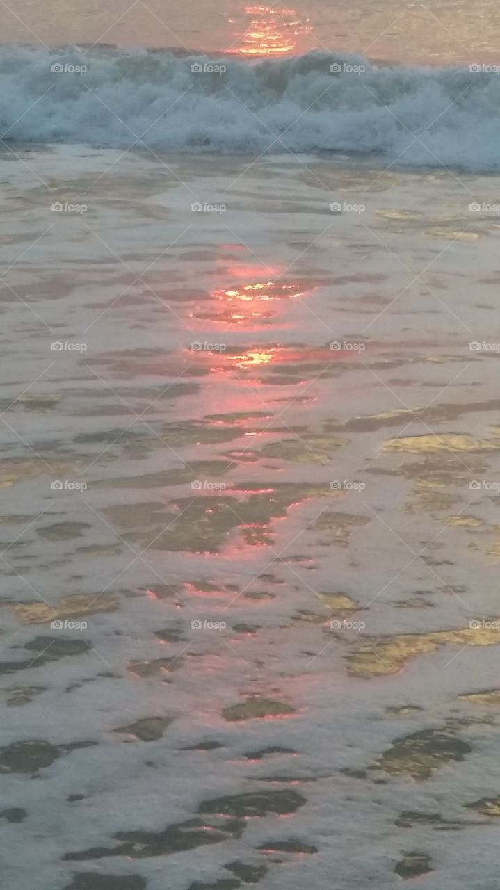 reflection of sunrise on sea