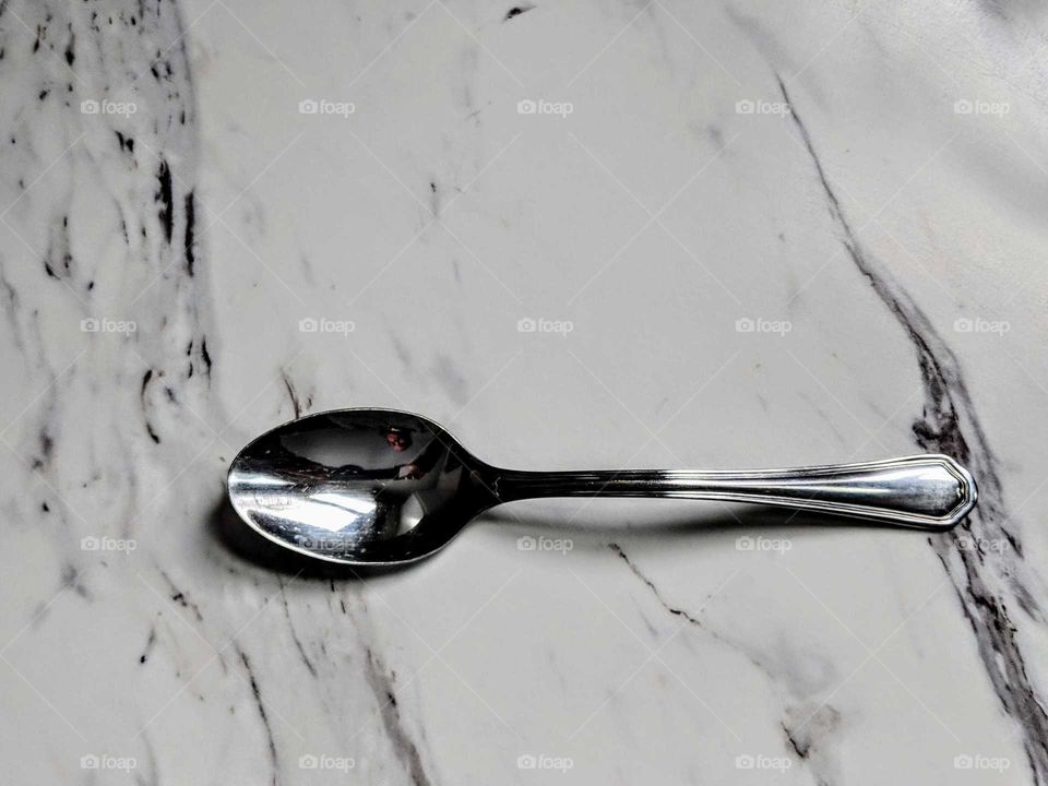 silver spoon on a counter