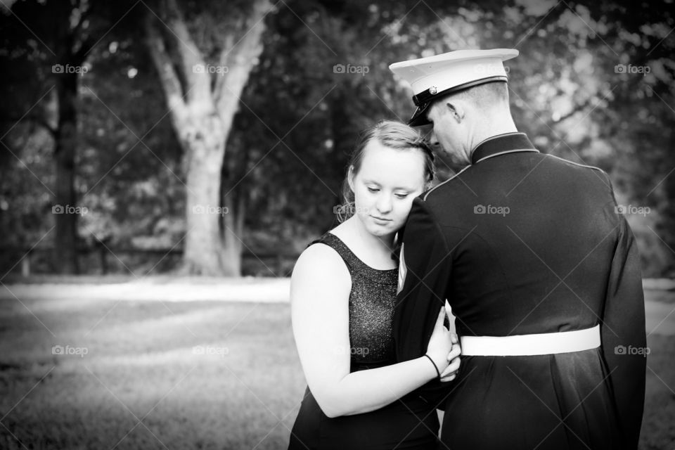 Solemn black and white military couple photo