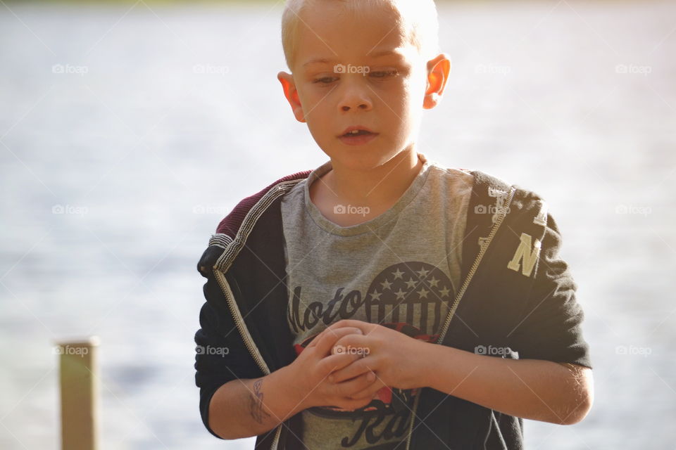 Boy walking in the summer light