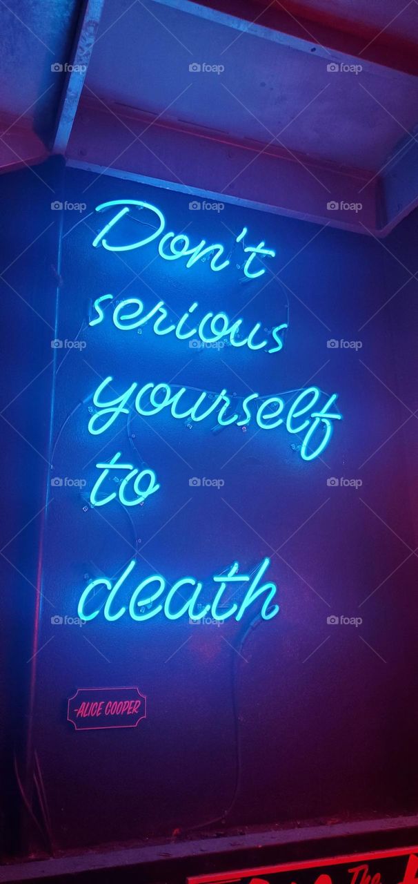 Blue Neon Sign don't serious yourself to death