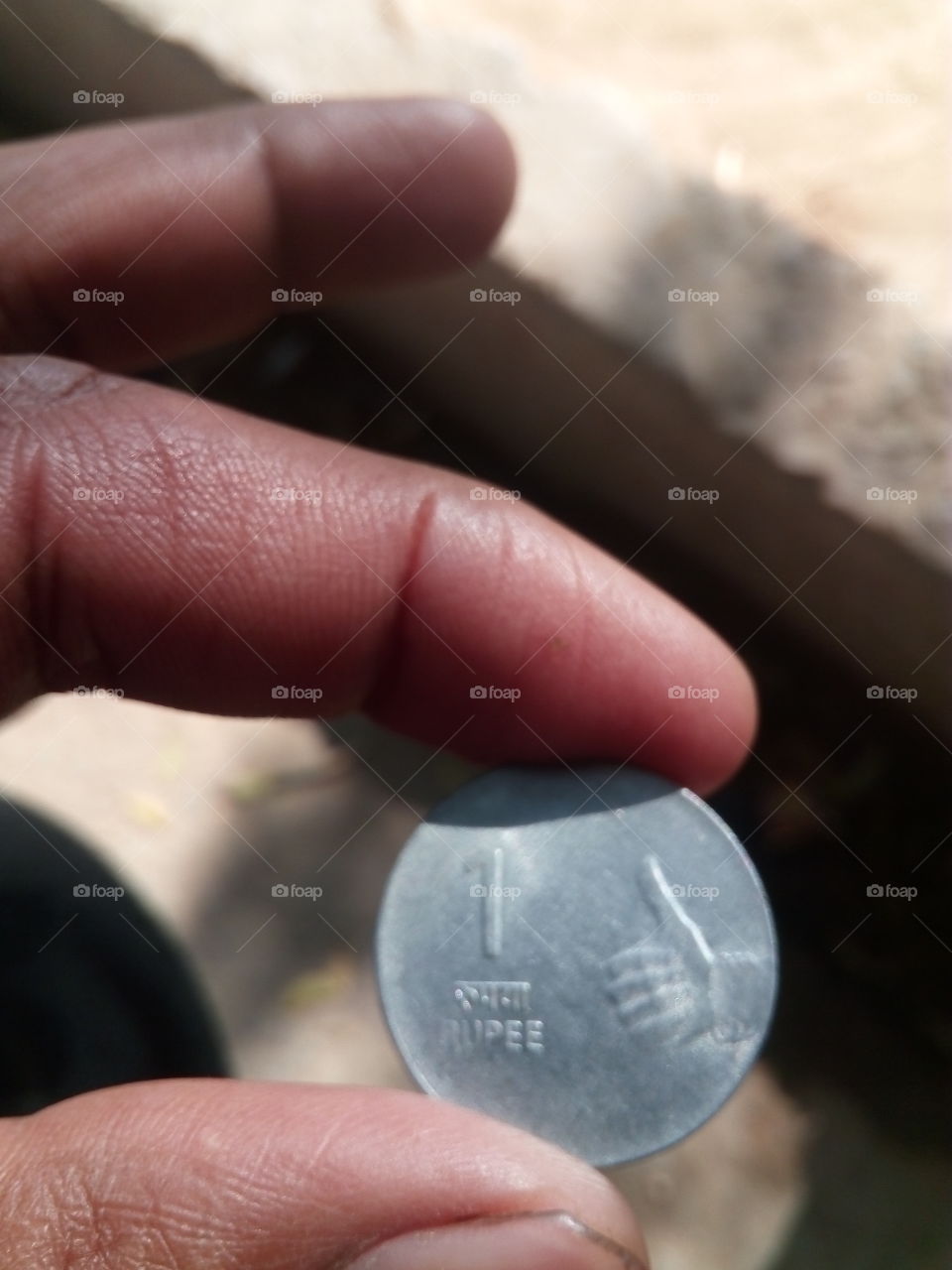 coin with hand