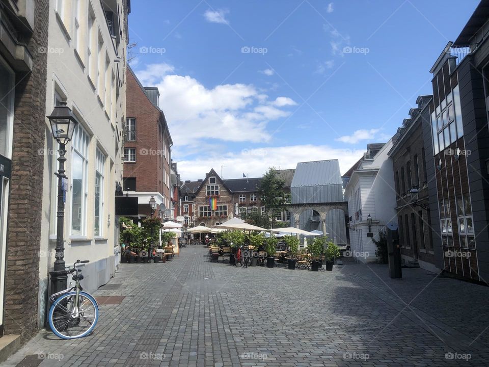 Bicycle with flat tire on empty square 