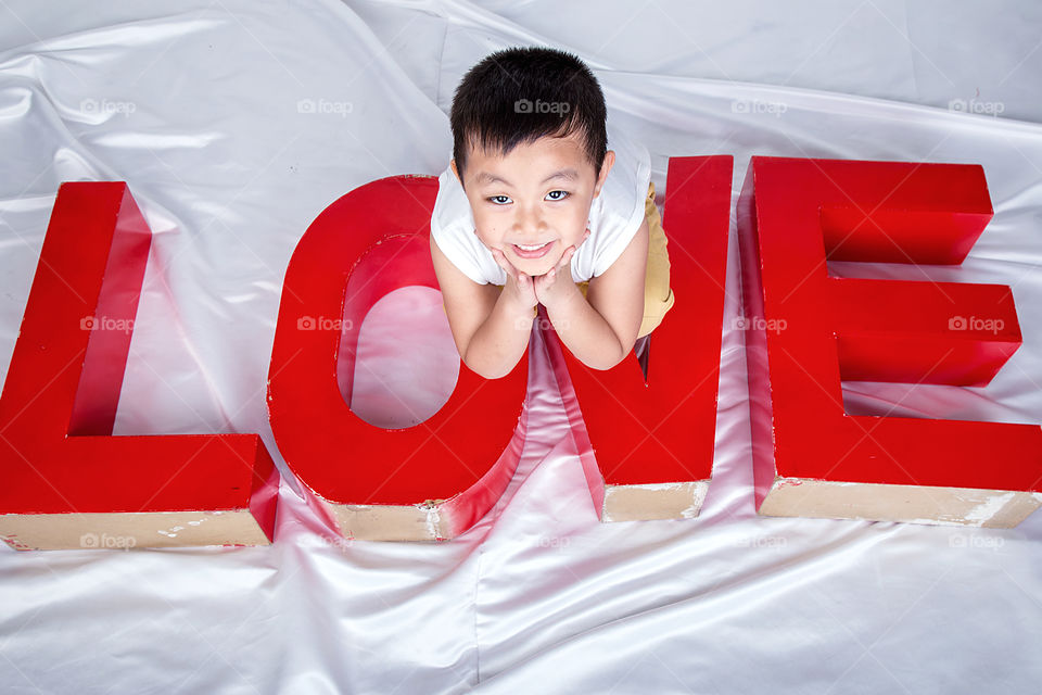 High angle view of boy on love text