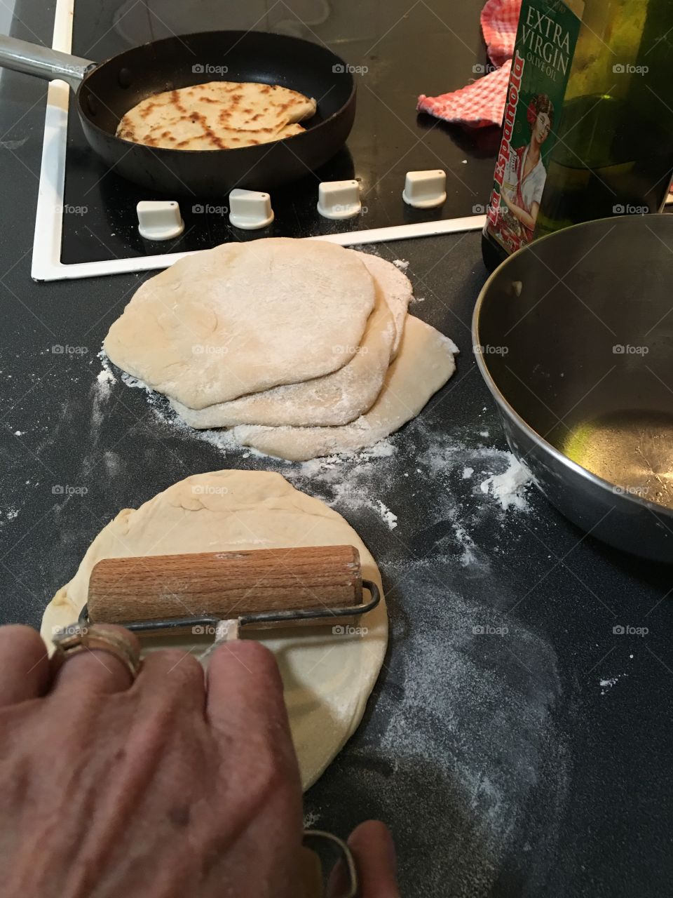 Handy woman making homemade bread dough for pitas