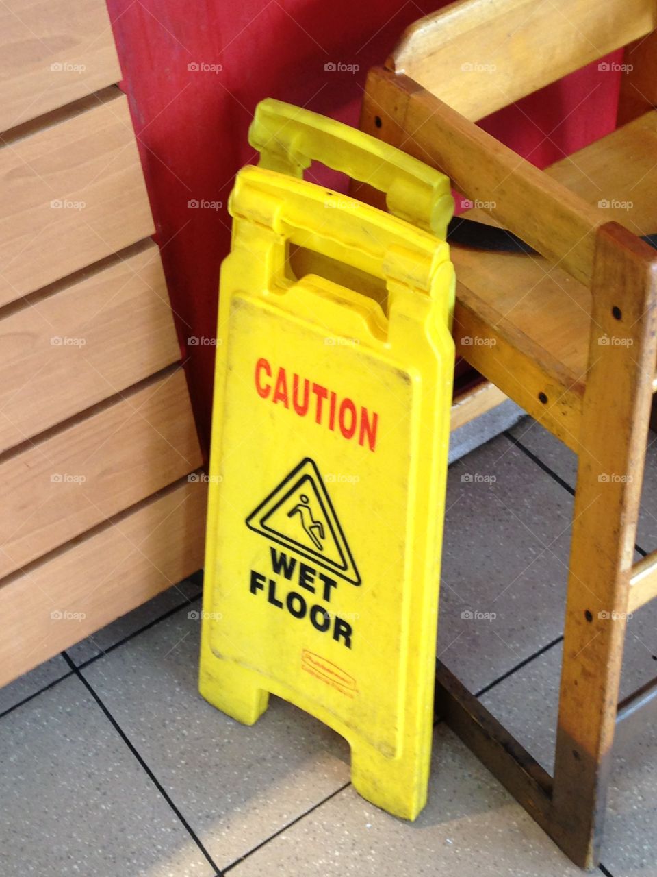 CAUTION WET FLOOR - safety signs from the cleaning staff at the restaurant