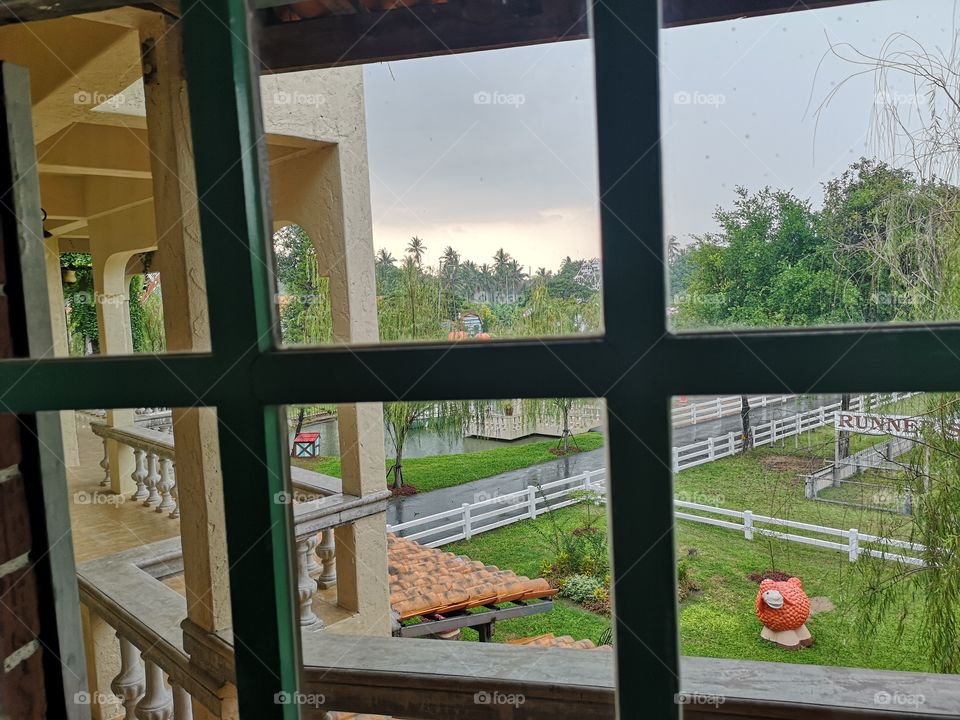 Looking through the window to find the farm outside.