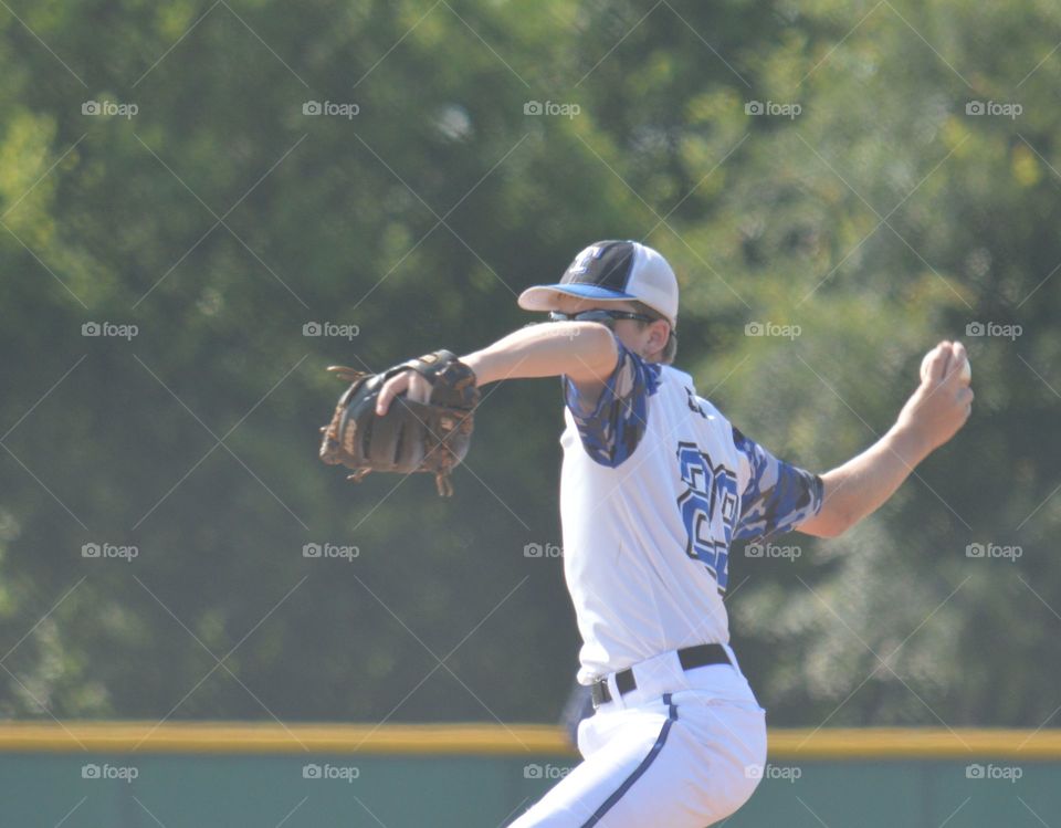 13 year old boy pitching in a Texas  baseball tournament. 