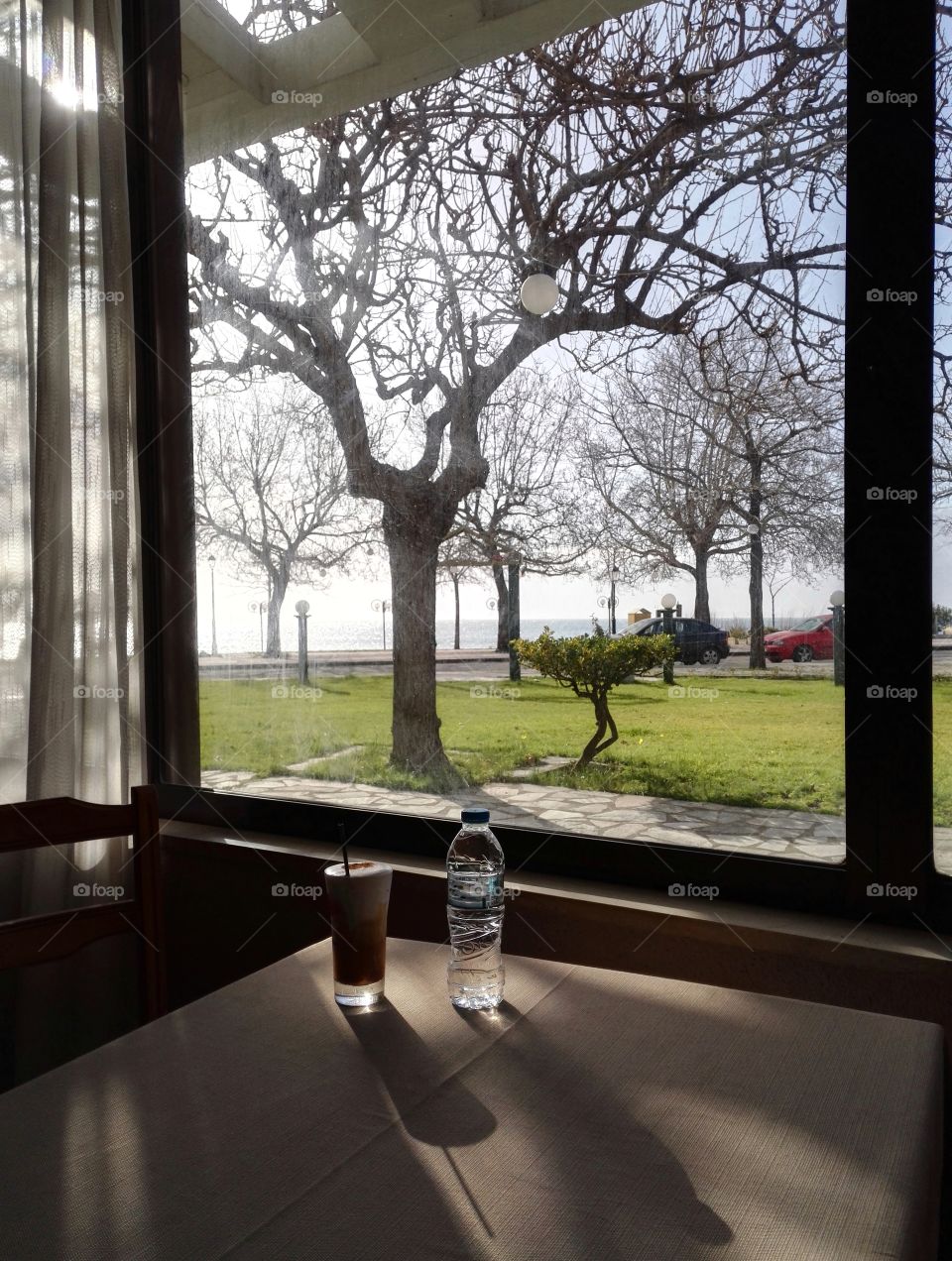 cold frappe and water on table indoors