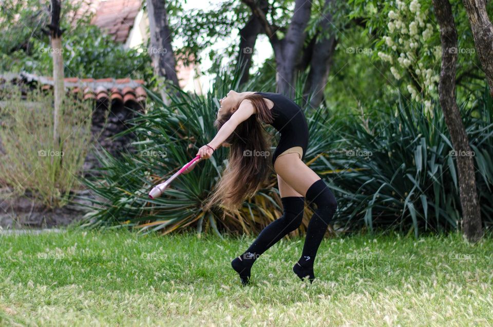 Beautiful Young Gimnast Dancing in Nature