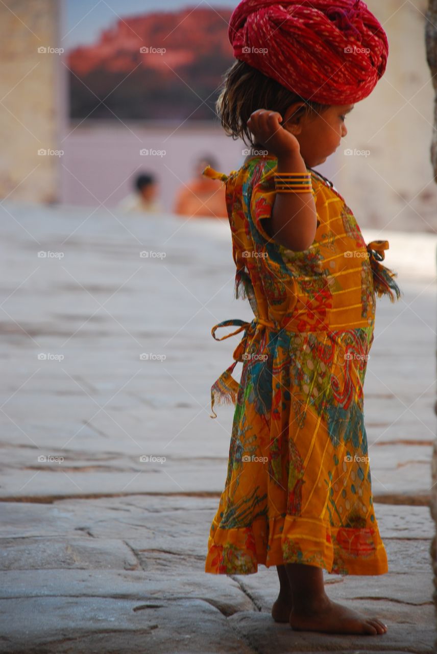 Merangar palace, child wearing colorful outfit