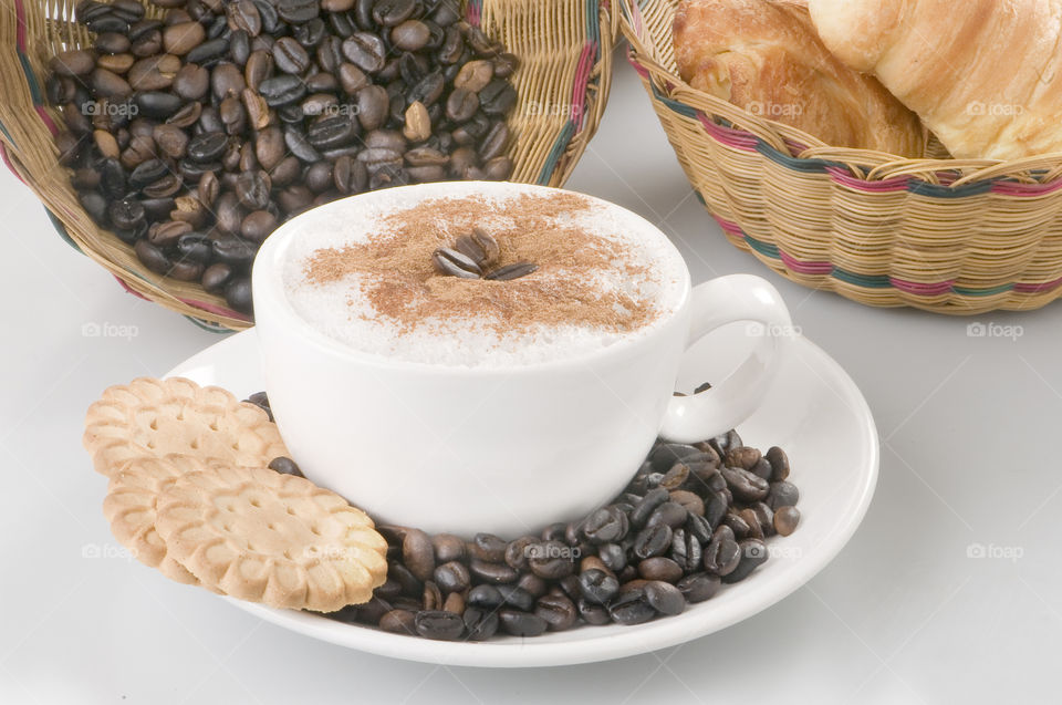 Cappuccino With Coffee beans and biscuits