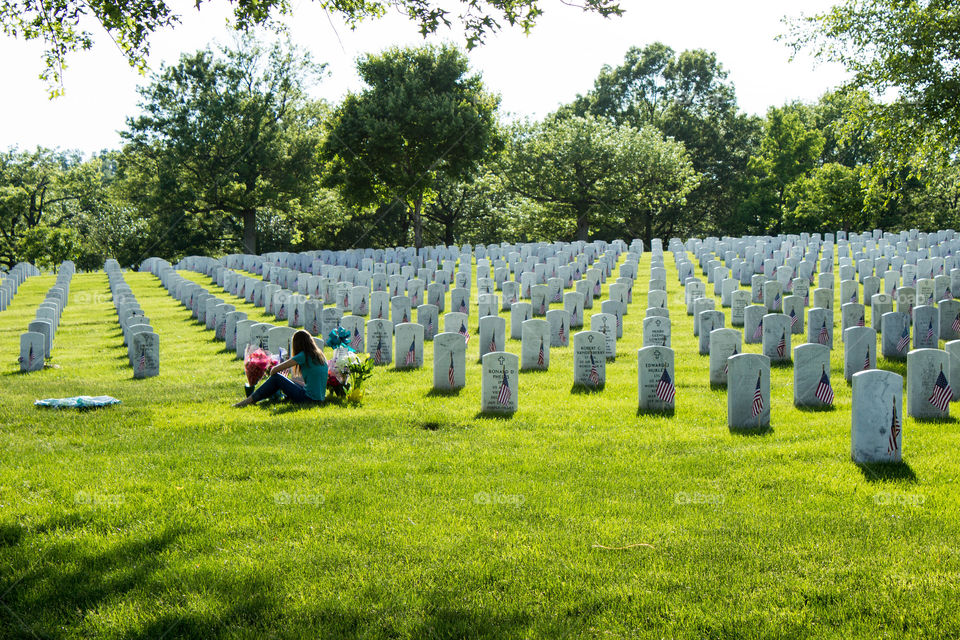 A woman mourns the fallen on Memorial Day at Arlington National Cemetery, VA. 